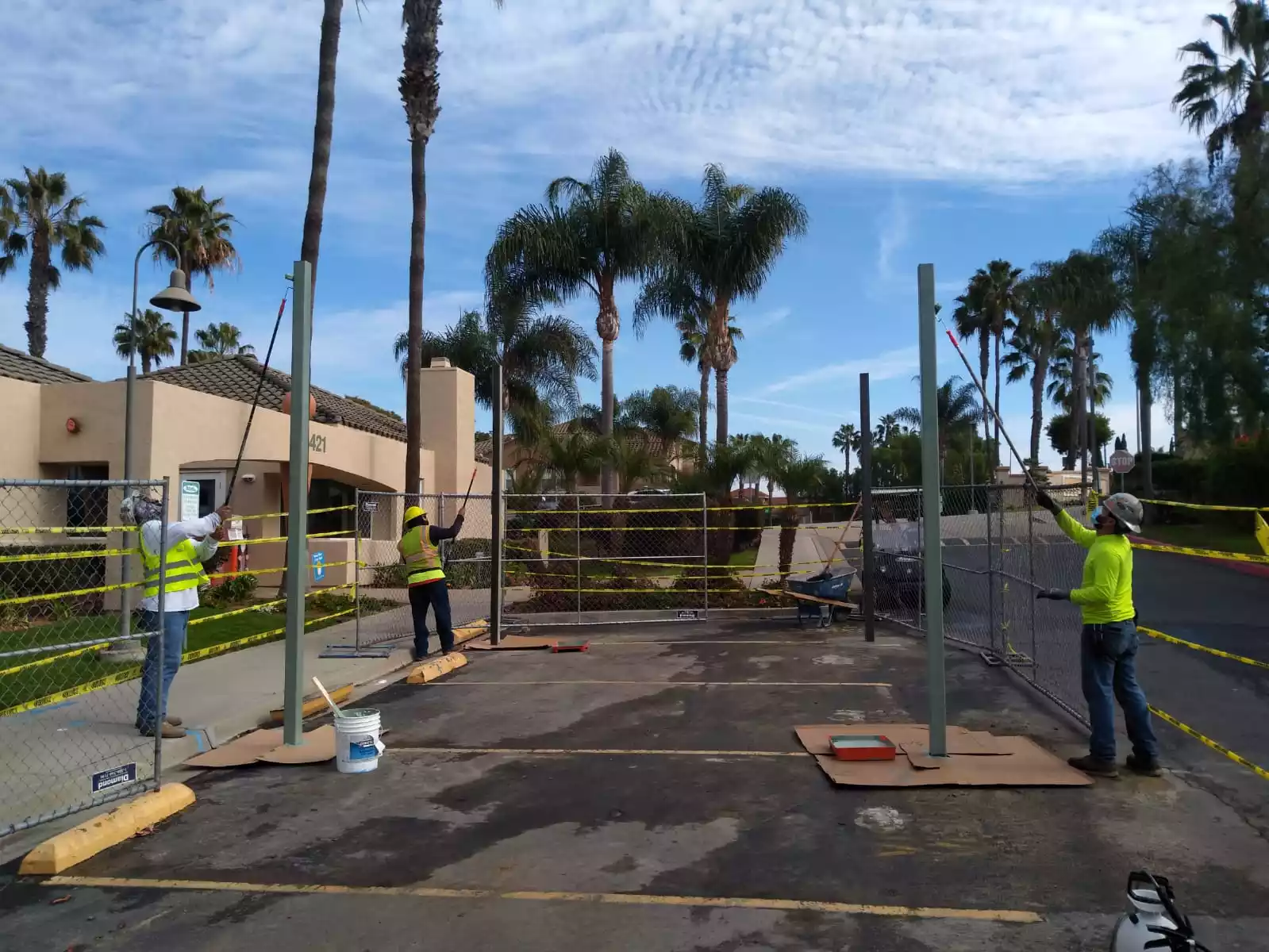 general photos of people working to install a shade